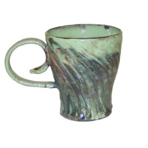 A green mug with a handle on the side.