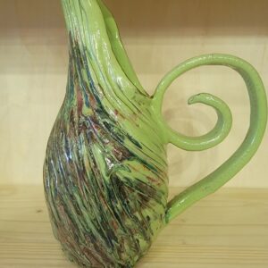 A green glass vase with a spiral handle.