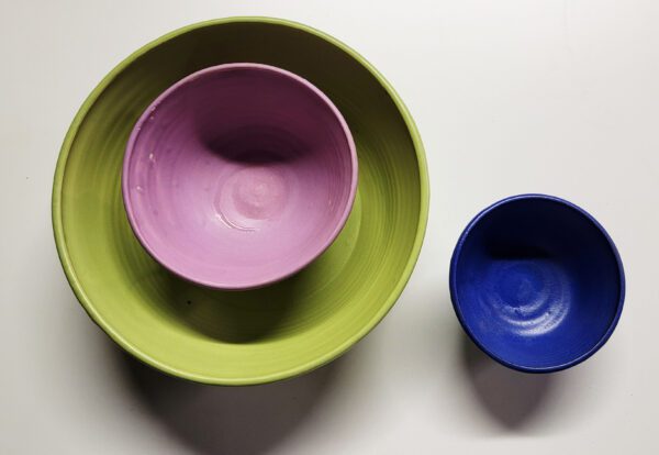 Two bowls are shown in a row, one of them purple and the other blue.