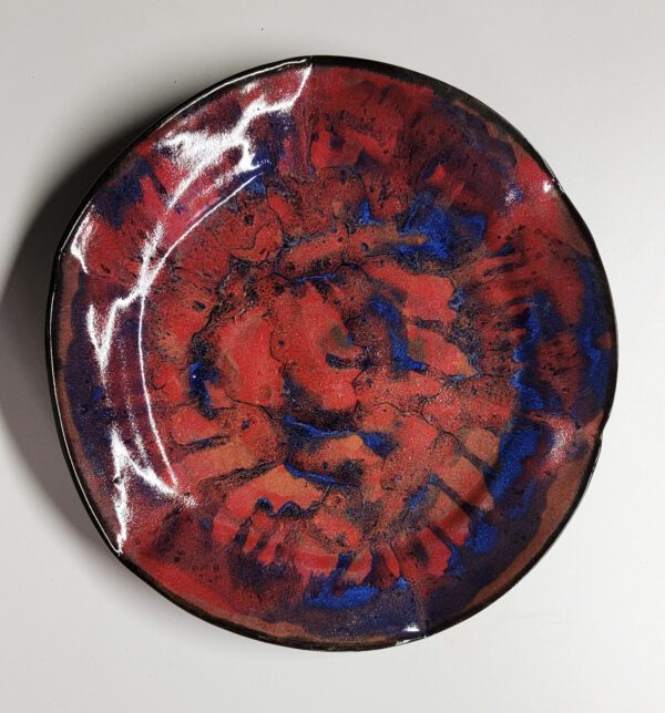 A red and blue plate with some black lines