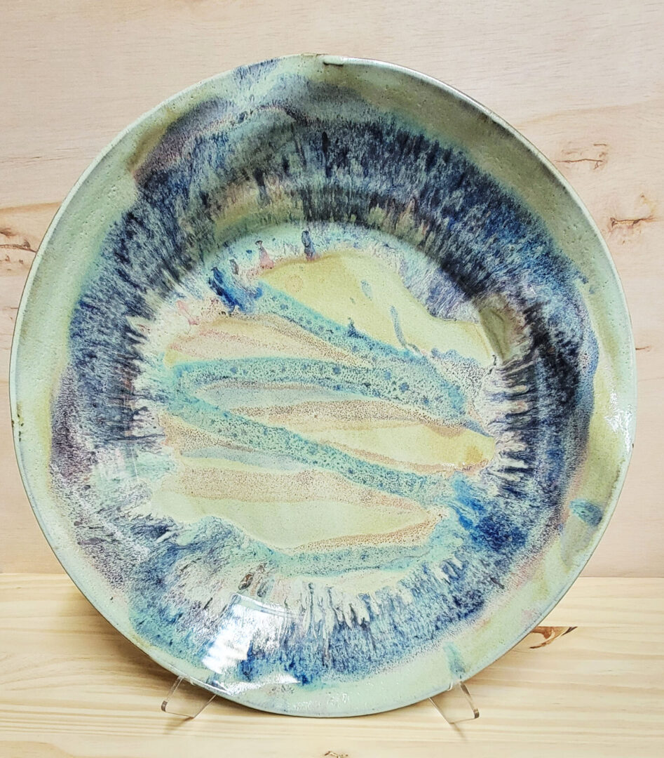 A plate with blue and green colors on it