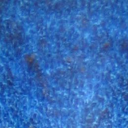 A blue carpet with some black spots on it